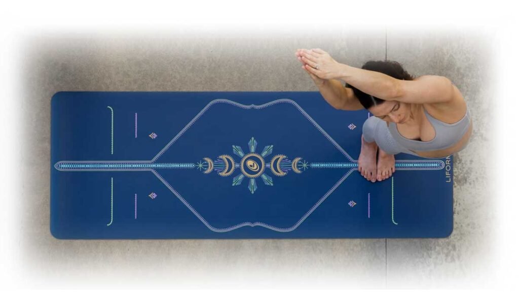 Liforme Original Yoga Mat with alignment markers unrolled in a yoga studio