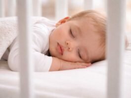 safe nursery setup with a modern baby crib for newborns